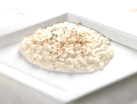 Risotto al taleggio con granella di nocciole, flambé al cognac